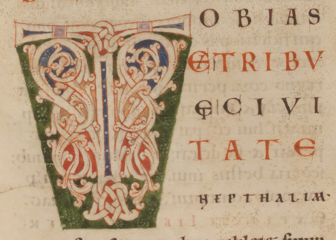 Initial with foliage and a green frame.